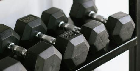 rack of assorted sized dumbells