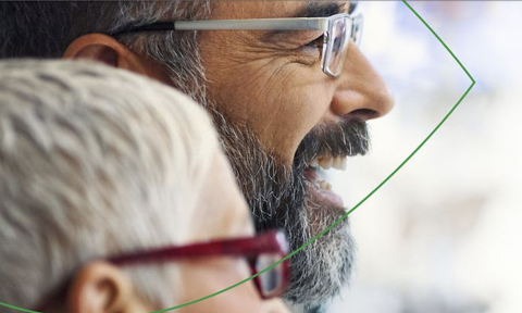 Two people with glasses on looking to the right