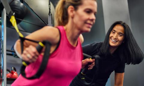 Women working out with TRX rings