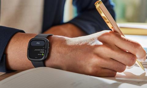 A mans hand with a smartwatch on 