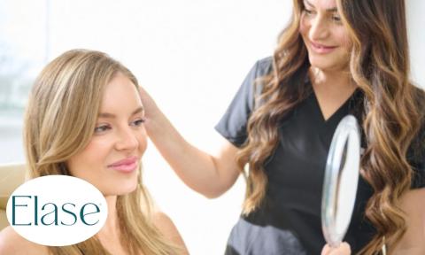aesthetician showing woman her reflection in hand held mirror with Elase logo on bottom left corner