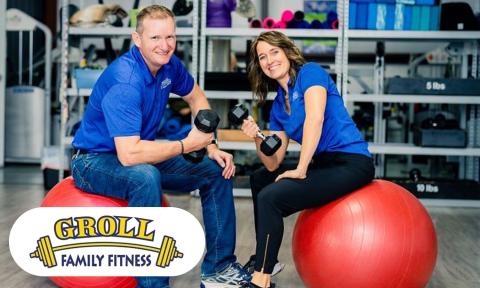 Two people sitting on rubber balls with weights, Groll Family Fitness logo in bottom left corner