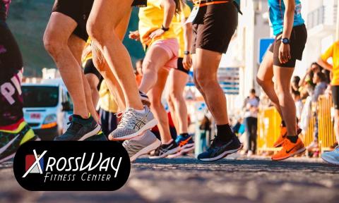 many legs at the beginning of a race with xrossway fitness logo on bottom left corner