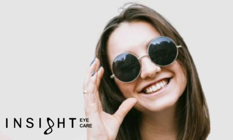 Women with round sunglasses on with insight eye care logo in lower left corner