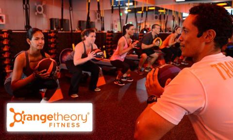 individuals participating in a fitness class at Orange Theory