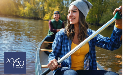 woman in a canoe with 20/20 institute logo in bottom left corner
