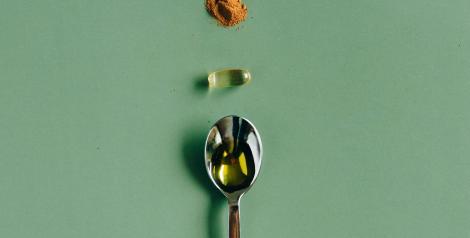 supplements and a spoon on a table