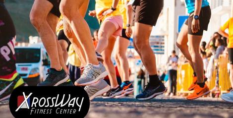 many legs at the beginning of a race with xrossway fitness logo on bottom left corner