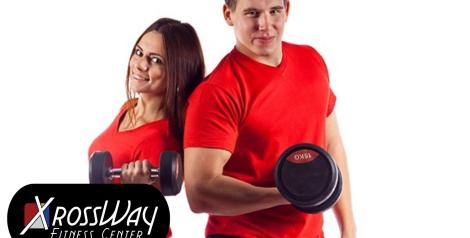 woman and man standing back to back with red shirts, black bottoms and holding a free weight with xrossway fitness logo on bottom left corner