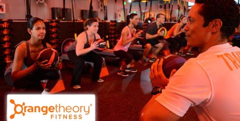 individuals participating in a fitness class at Orange Theory