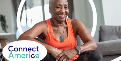 elderly woman in athletic clothing with medical alert alarm on neck with connect america logo on bottom left corner