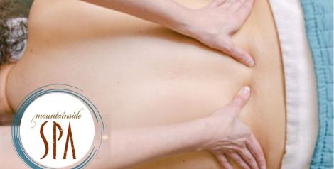 Massage therapist massaging a back, mountainside spa logo on bottom left corner