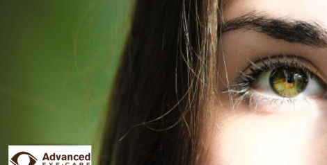 dark haired woman with green eyes with advanced eye care logo in bottom left corner