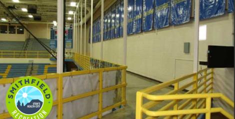 indoor walking track around gym with 4 basketball courts, Smithfield Recreation logo in bottom left corner