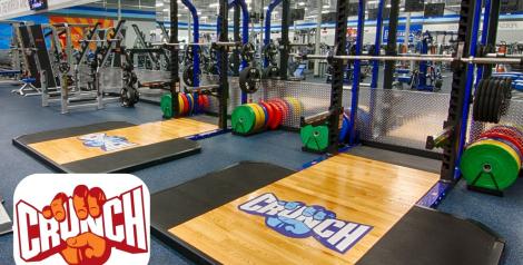 weight lifting rack and weights, Crunch fitness logo in bottom left corner