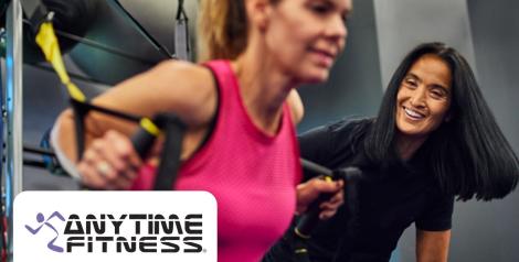 Women working out with TRX rings, Anytime Fitness Logo in bottom left corner