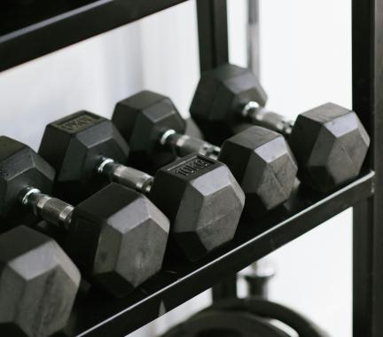 rack of assorted sized dumbells